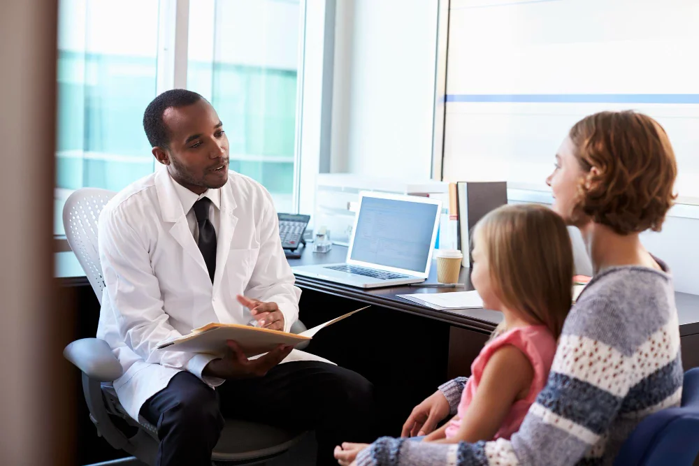 Doctor going over psychiatric aftercare and medication plans with a family in orlando