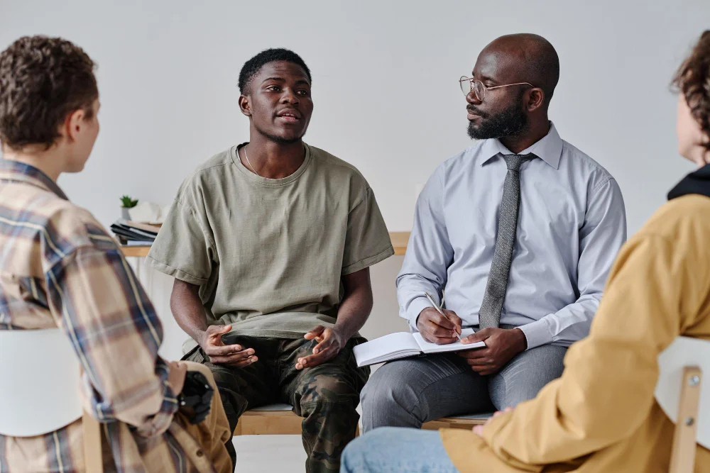 Therapist leading a supportive group therapy and counseling session in Orlando